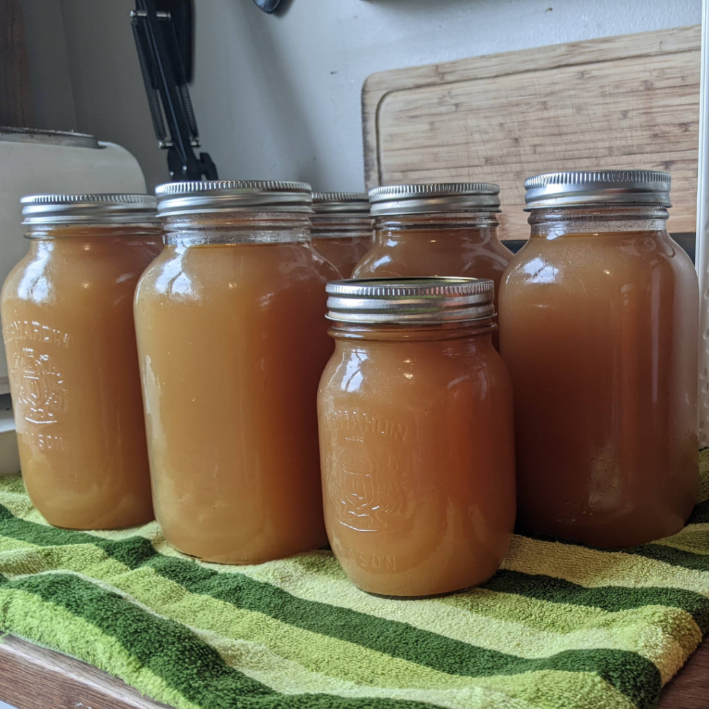 Jars of home canned chicken stock