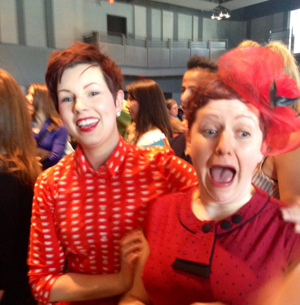 Friend and Heather standing together. Heather's excited and surprised face the moment they announced that her cupcakes won the "most captivating cupcake" category. 